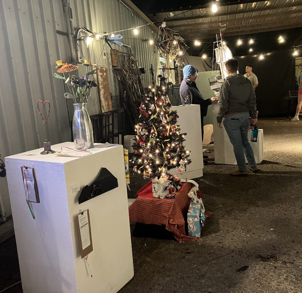 assorted art and people at the art auction